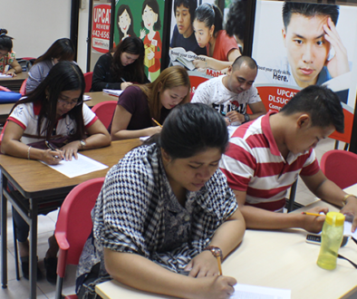 Students studying for civil service exam review